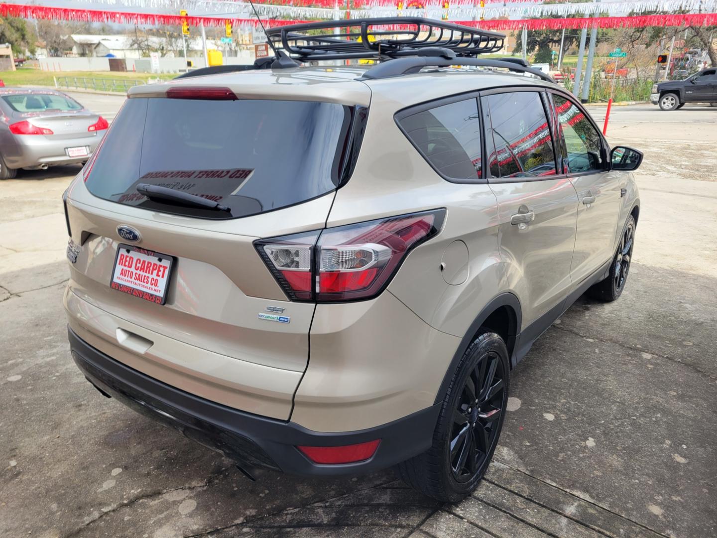 2018 Gold Ford Escape (1FMCU9GD5JU) with an 1.5L I4 F DOHC 16V engine, Automatic transmission, located at 503 West Court, Seguin, TX, 78155, (830) 379-3373, 29.568621, -97.969803 - 2018 Ford Escape SE 4WD with a 1.5L I4 F DOHC 16V, Automatic, Tilt, Cruise, AM/FM/CD Touchscreen Stereo, Power Windows, Locks, Seat and Side Mirrors, Bluetooth, Navigation, Automatic Headlights, Dual Climate Control, Rear A/C, Heated Seats, Tinted Windows, Luggage Rack, Backup Camera, Bumper Sensors - Photo#2